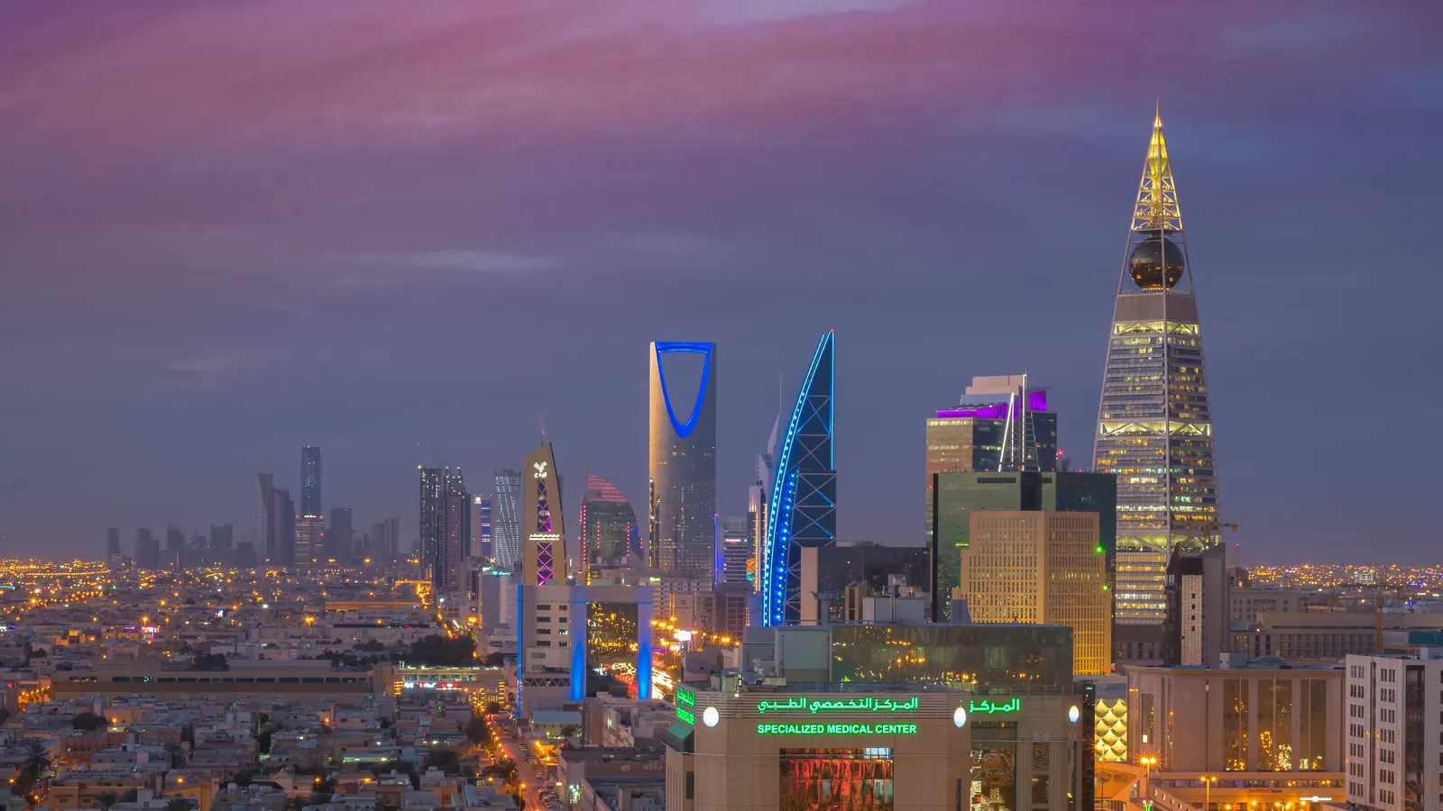 Olaya, Riyadh, at dusk, with Kingdom Centre and Al Faisaliah Tower lit against the sky